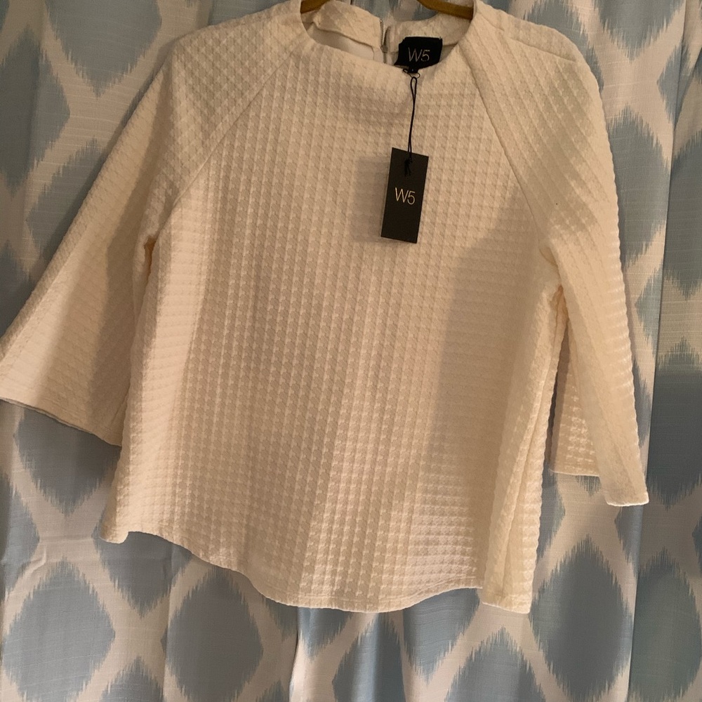 W5, cream blouse.